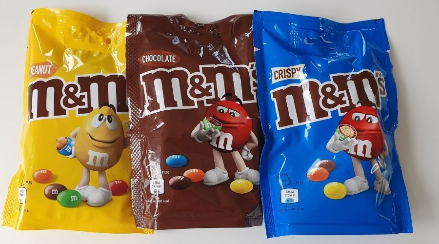 various M&M packs including peanut, crispy and chocolate