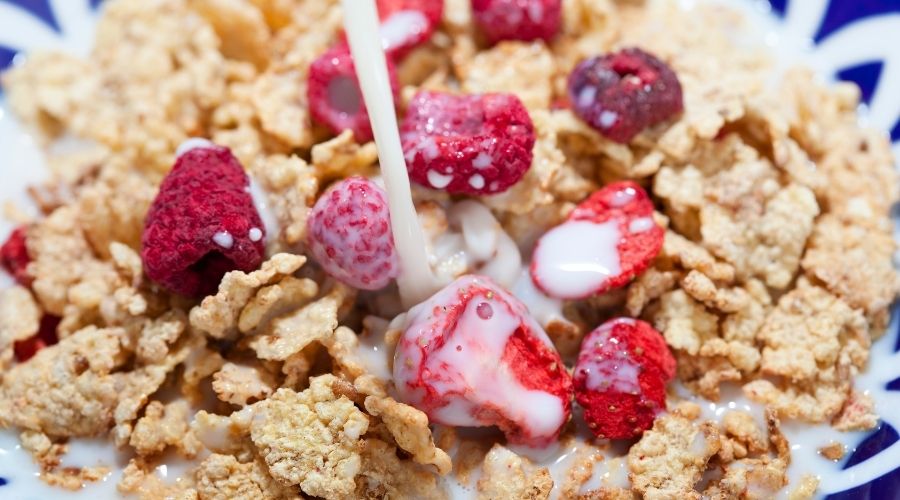 special k in a bowl with raspberries and milk to show what they look like