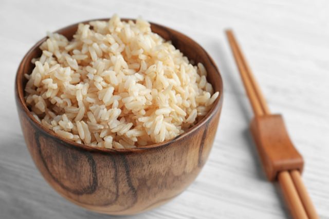 Wooden bowl of brown rice